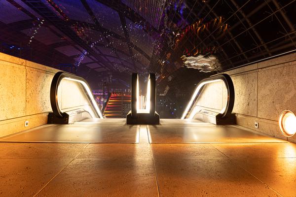 Escalators on 36c3 with the Glass hall at Leipzig Messe in the Background
